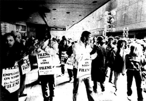 Black and white workers on a picket line